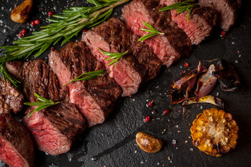 Chopped red wine steak on a wooden table.