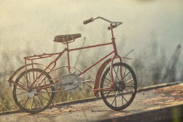 Fototapeta na wymiar Red vintage bicycle under rain
