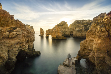 Fototapeta na wymiar Sunrise over stunning cliffs and arches in Ponta da Piedade, Lagos, Algarve, Portugal