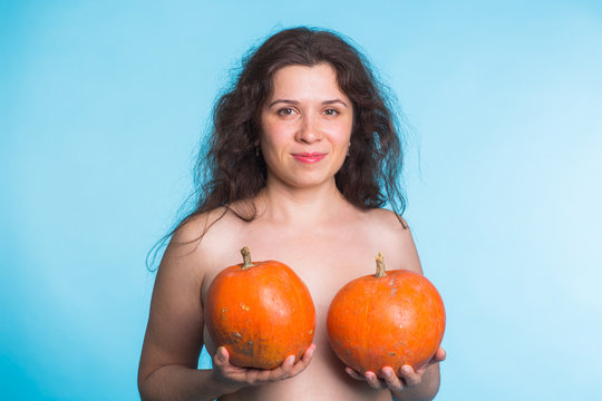 Plastic surgery concept - woman breast pumpkins implant upsize metaphor