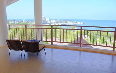 Fototapeta na wymiar Rattan Sofa on Balcony, Sea View Room