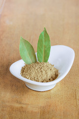 Fototapeta na wymiar Powder of dried bay leaf of the bay tree, used in cooking.