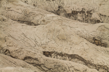 full frame of black sand on the wall of bromo volcano