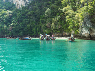 Naklejka na ściany i meble Emerald water and longtail boats near Hong island, Phang Nga National Park, Krabi
