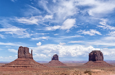 Fototapeta na wymiar View of the famous Monument Valley, Colorado, USA, in daylight with blue sky full of clouds