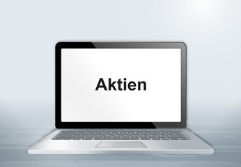 Fototapeta premium Laptop auf Holztisch - Aktien