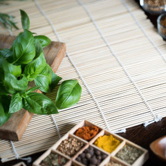 Fresh basil and dry set of spices. place for text