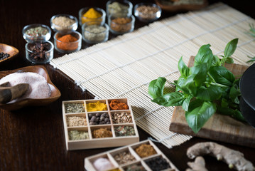 Fresh basil and dry set of spices. place for text
