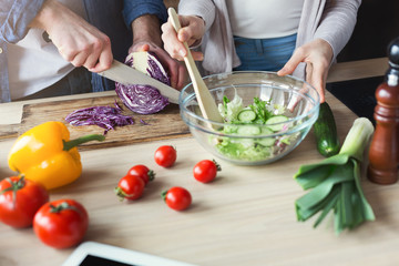 Closeup of couple cooking healthy food together