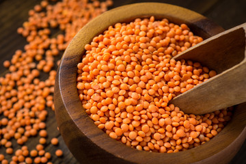 Red Lentils in Bowl on Wooden Table