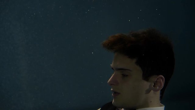a young actor dressed in a wedding suit, submerged under water, a fairy-tale hero will take part in an underwater performance, where you need to hold your breath
