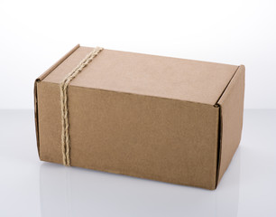 Cardboard box tied with rope. The packaging of the parcel