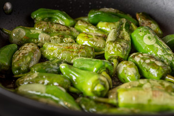 Pimientos de Padrón. Preparing Green Padron Peppers in the Frying Pan.