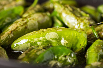 Pimientos de Padrón. Preparing Green Padron Peppers in the Frying Pan.
