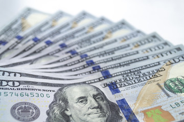 Dollars, closeup photo of one hundred dollar banknotes on white background. Macro shot