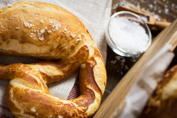 Pretzel with Sea Salt on Rustic Wooden Background