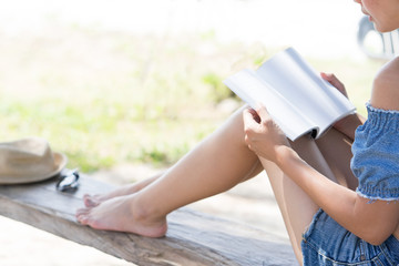 Woman holding blank book.  Relaxing concept.