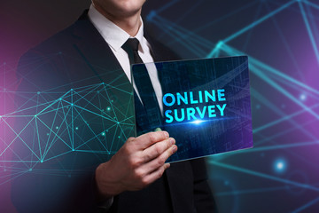 Business, Technology, Internet and network concept. Young businessman working on a virtual screen of the future and sees the inscription: Online survey