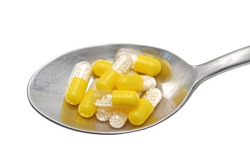 spoon with pharmacy pills