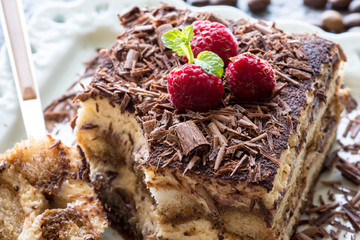 Tiramisu Cake with Grated Chocolate, Raspberry and Mint. Perfect Dessert.