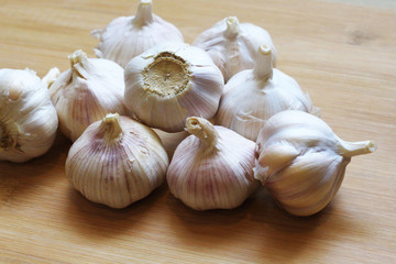 Garlic for cooking on wooden floor