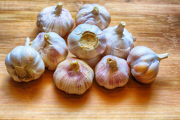 Garlic for cooking on wooden floor
