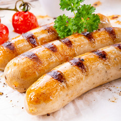 delicious bratwurst with ketchup and fresh rolls