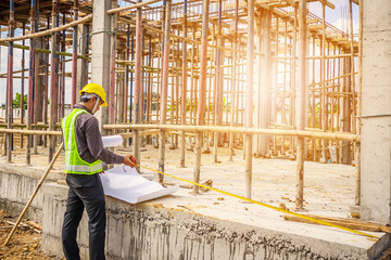 Asian business man construction engineer worker at house building site