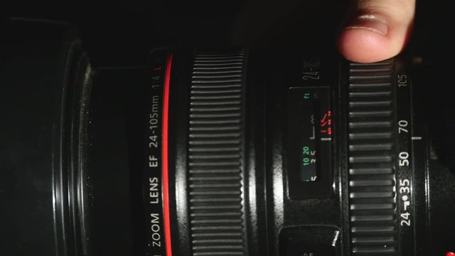footage of a Man changing the settings dslr camera
