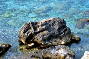 The beacth with rock and sun