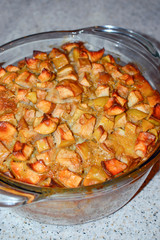 Fresh hot apple pie in glass bakeware, delicious homemade sweet dessert from oven