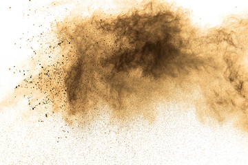 abstract brown dust explosion on white background. abstract brown  powder splattered on white...