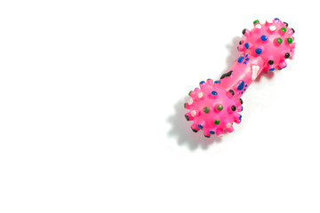 Pink rubber toys for dog on isolated white background.
