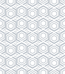 Abstract seamless pattern of hexagons and triangles.