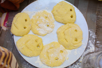 Children and chefs make dough on the table with their hands