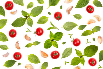 Pattern of Basil leaf and garlic clove with tomatoes. Kitchen and Ingredient wallpaper with abstract composition of vegetable concept