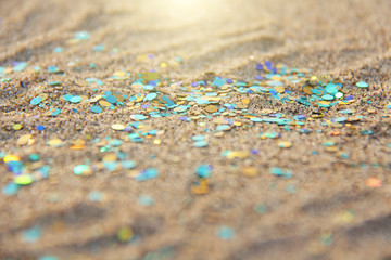 Green, blue or turquoise Soft Blurred Boke Background. Spangles and Shiny Silver Color Background. Bright Background. Glamorous background for your design and decoration. Sparkles on the sand. Magic