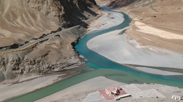 Aerial view of Confluence of the Indus and Zanskar Rivers are two different colors of water , between Kargil and leh,India