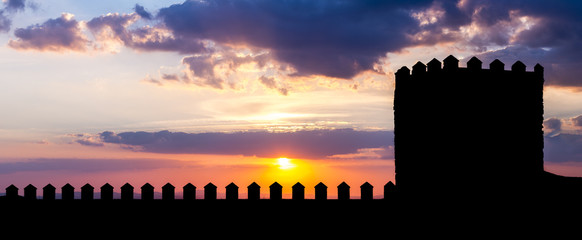 Silhouette of castle in sunset