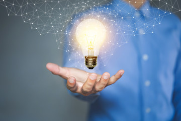 Light bulb, Innovative idea in the hand of businessman.