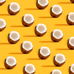 Series of coconuts on a yellow background