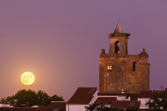Bell tower of church with super moon