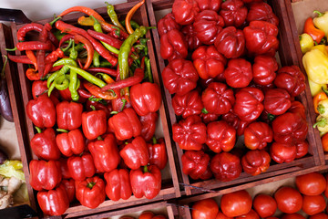 Pepper in a box on the counter of a vegetable store