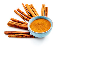 Cinnamon seasoning. Sticks and powder on white background copy space