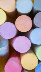 vibrant colorful chalk in a bucket