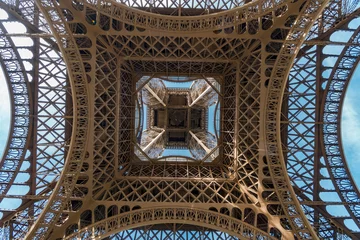 Fotobehang POV from under the Eiffel tower centar in Paris, France © zefart