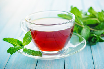cup of black tea with fresh mint