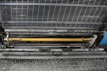 Close-up of soiled paint printing machine