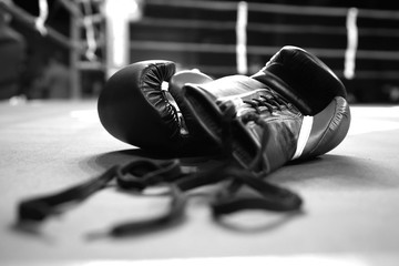 Boxing gloves in boxing ring