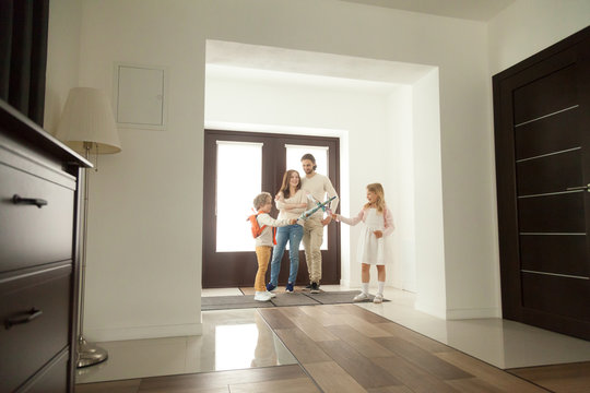 Cute Kids Sister And Brother Playing Fighting Umbrellas Getting Ready Go To School At Home, Children Boy And Girl Having Fun Standing At Hallway With Parents, Happy Family Preparing For Walk In The